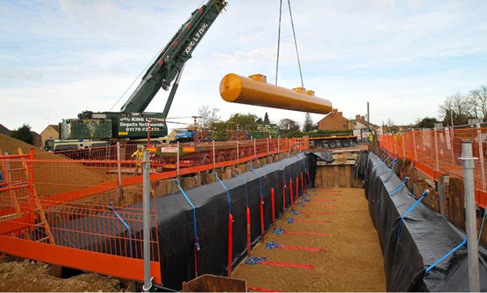 Groundworks support equipment being used on petrol tank installation to the groundwork